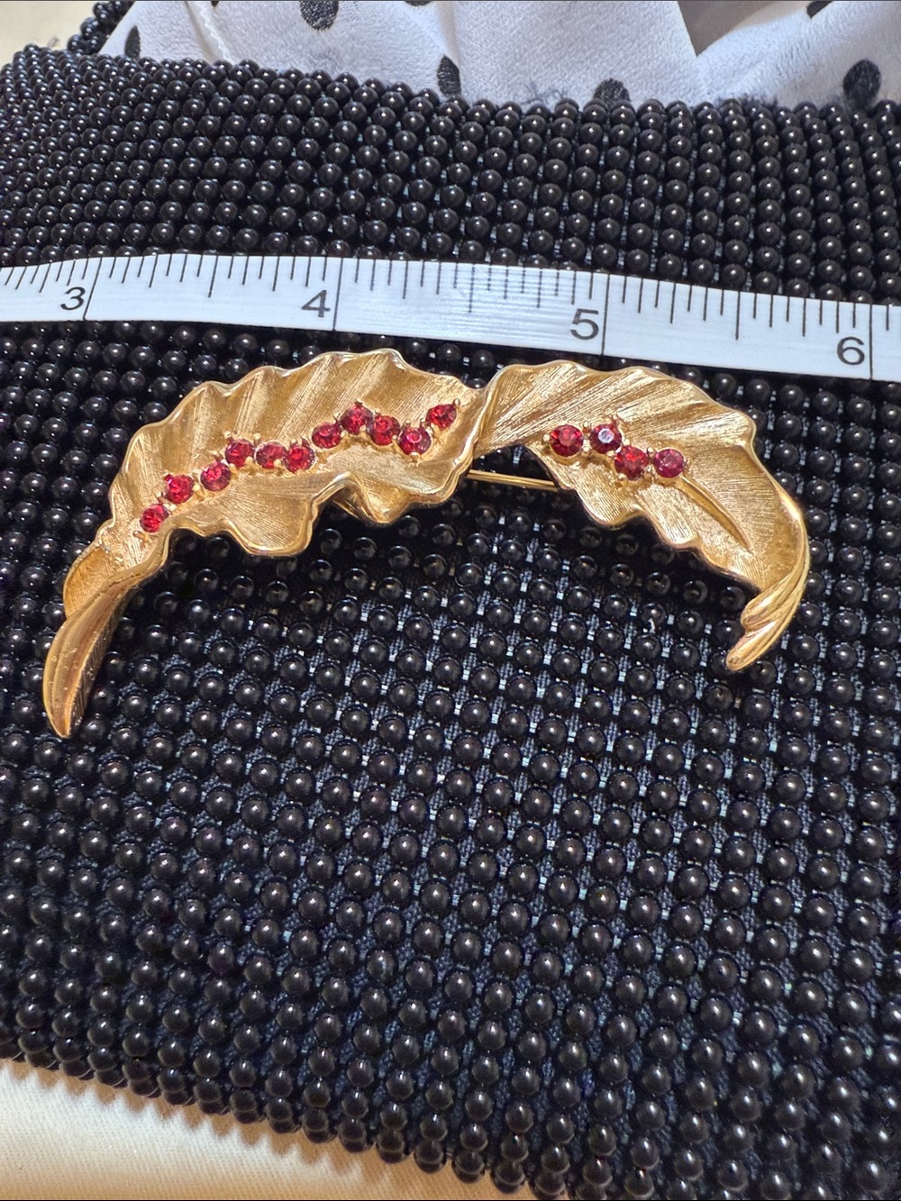 Trifari Gold Leaf brooch with Red Crystal Accents